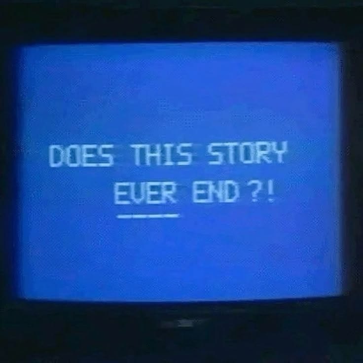 white writing on a crt screen that says 'does this story ever end?' with ever underlined