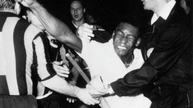 Pele punching out at players