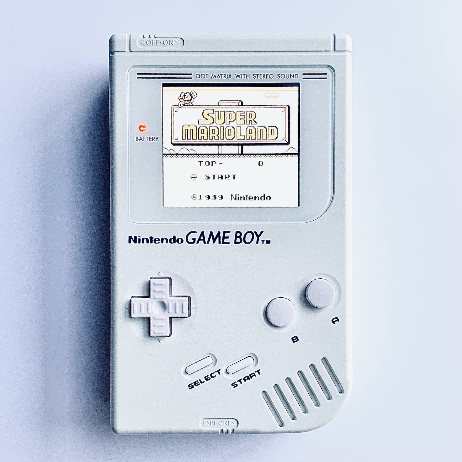 a white game boy with white buttons