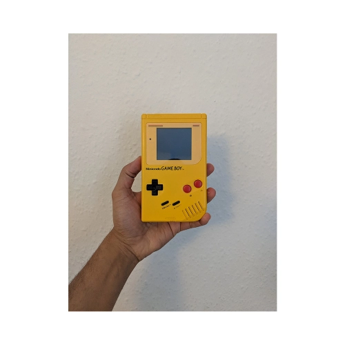 me holding a yellow Game Boy